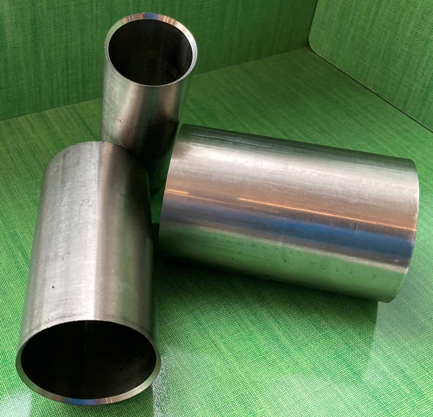 Three separate cylindrical T-FIT insulation tubes arranged in a T-shape, showing size variation.