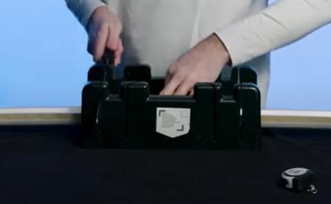 person using sharp knife and mitre block