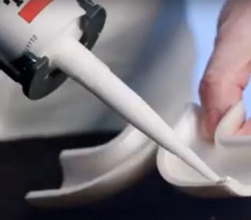 Person sealing 90-degree elbow