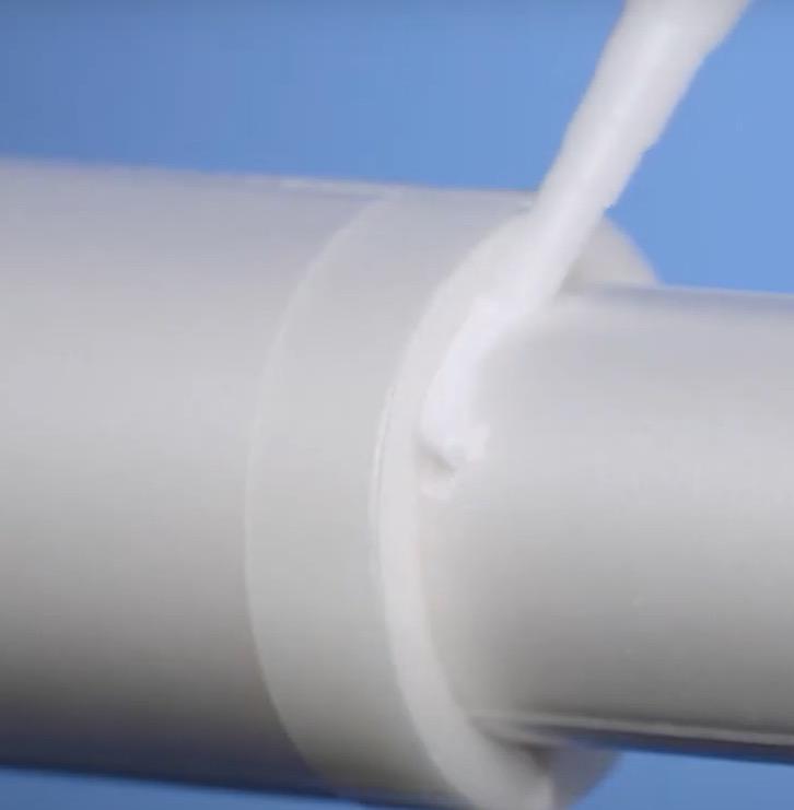 applying sealant to join between large and small tube